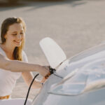 7woman charging electro car electric gas station 2